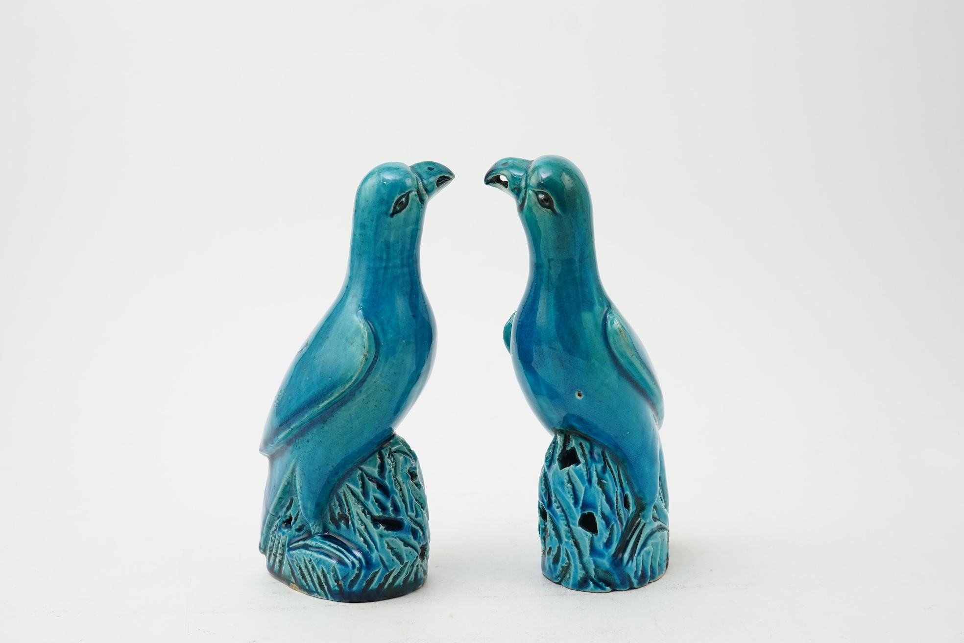 A pair of Chinese turquoise glazed models of parrots, 18th century